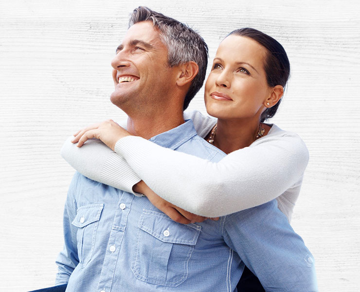 Middle aged couple holding each other and smiling | Internal Medicine | Seabreeze Medical PA